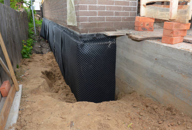 SJ Waterproofing Pros technician performing targeted Wet Basement Repair assessment in Canton, PA